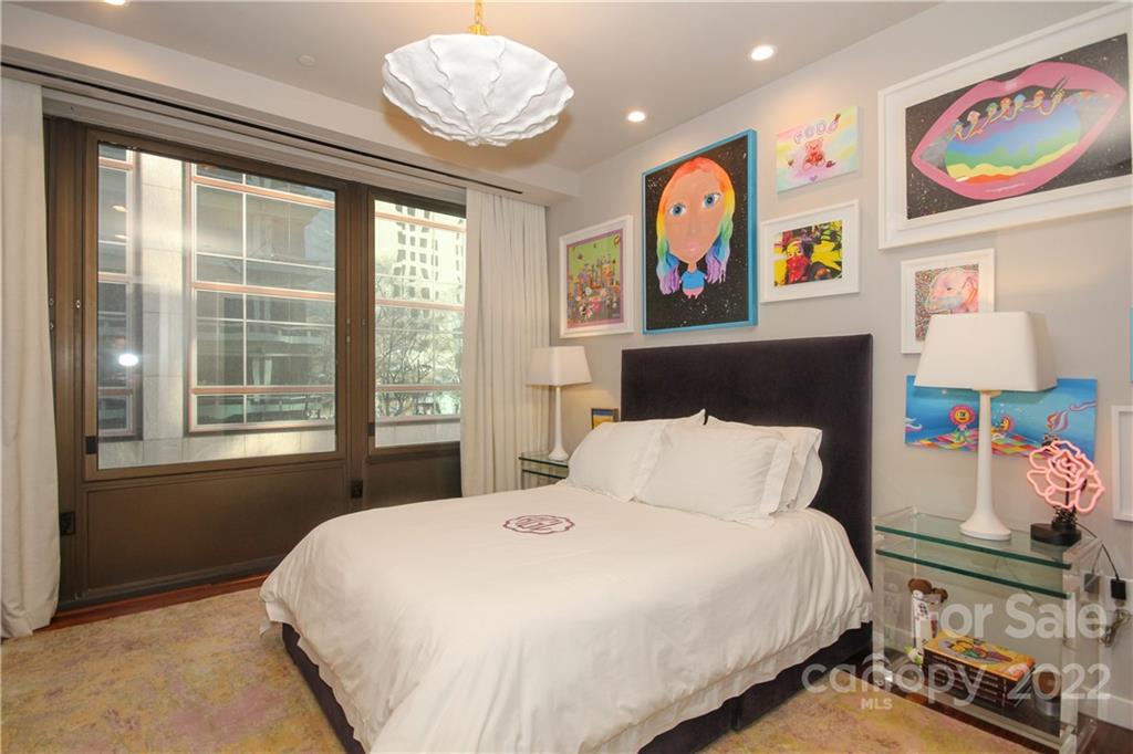 139 South Tryon Street Charlotte, NC 28202 - Photo 36 of 48 a bedroom with a bed and a window