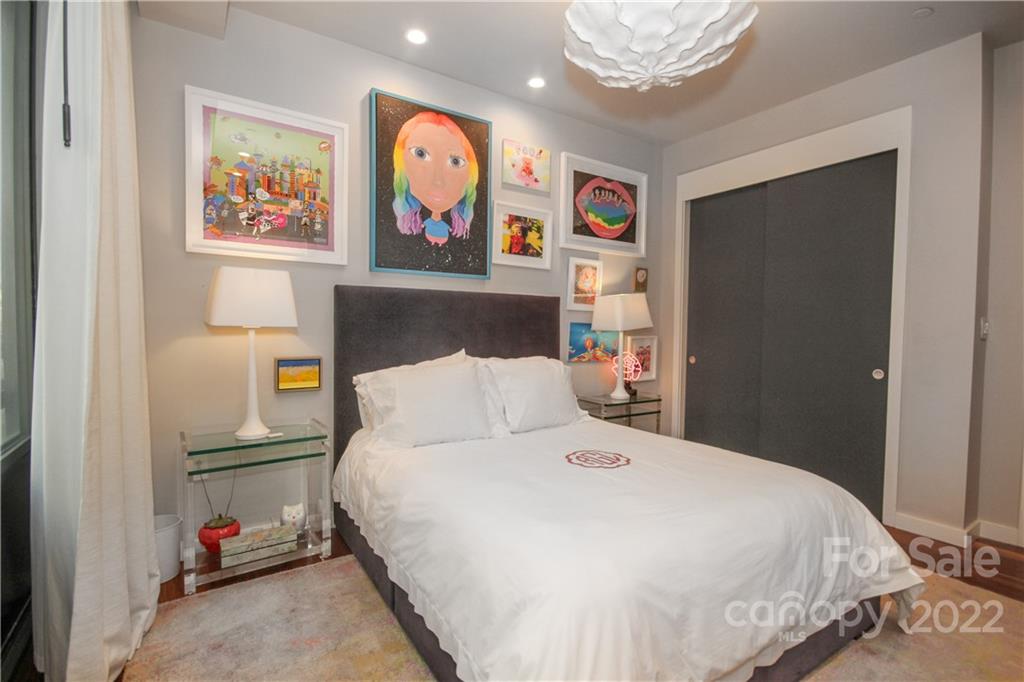 139 South Tryon Street Charlotte, NC 28202 - Photo 37 of 48 a bedroom with a bed and painting on the wall
