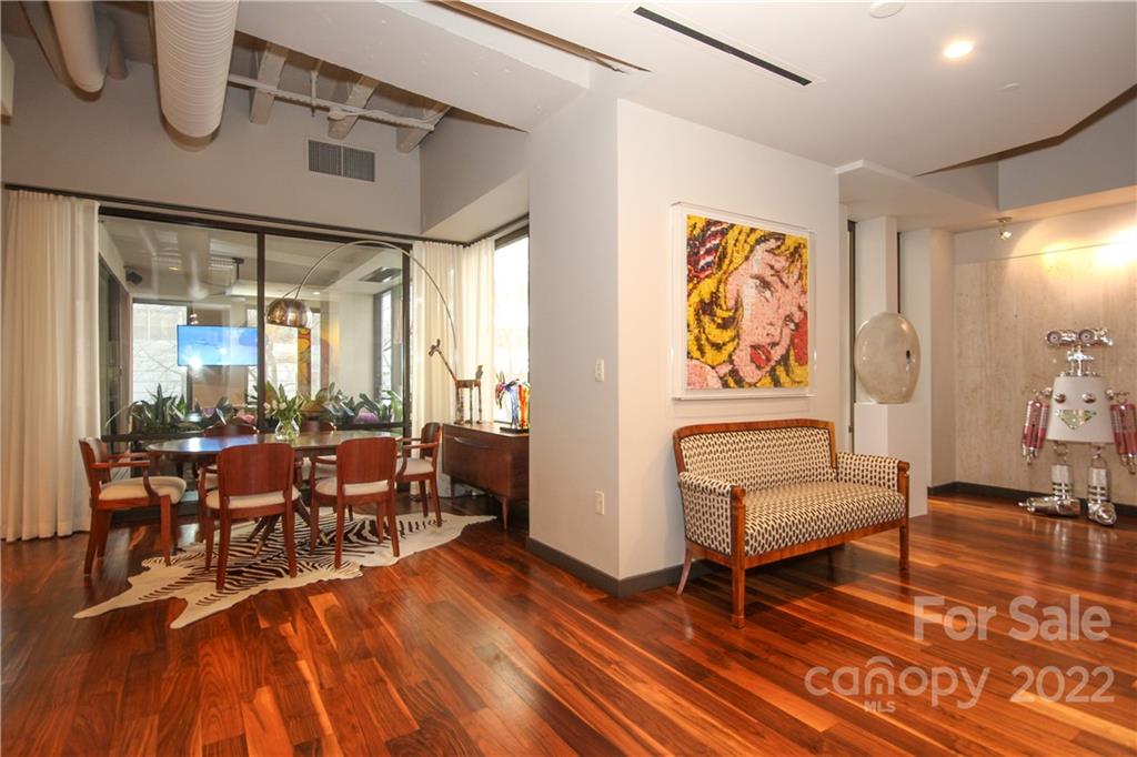 139 South Tryon Street Charlotte, NC 28202 - Photo 4 of 48 a living room with furniture a rug and a floor to ceiling window
