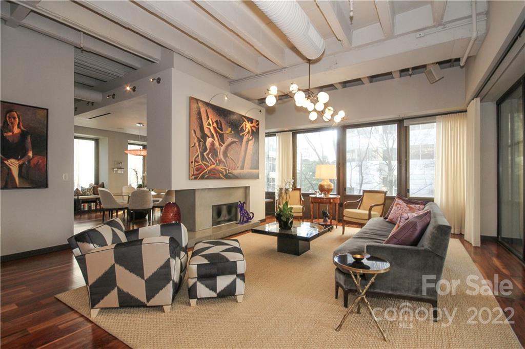 139 South Tryon Street Charlotte, NC 28202 - Photo 5 of 48 a living room with furniture chandelier and fireplace