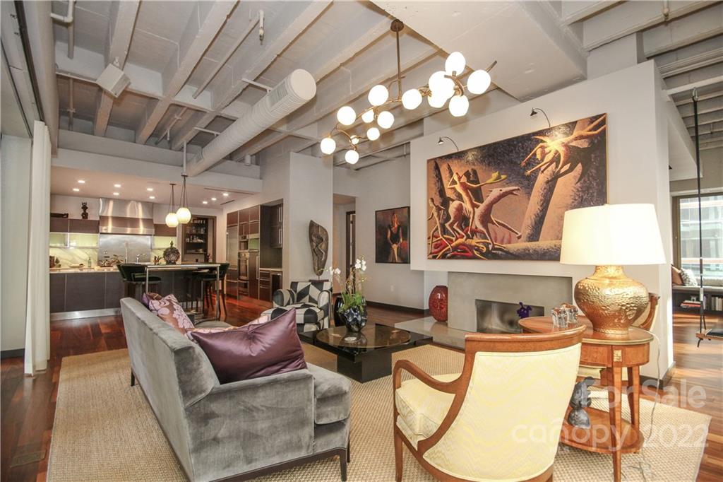 139 South Tryon Street Charlotte, NC 28202 - Photo 9 of 48 a living room with furniture and a chandelier