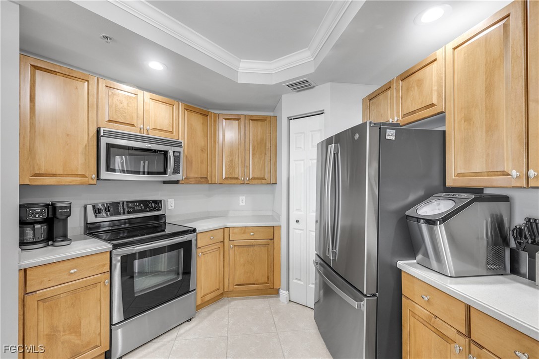 2743 First Street, Unit 1502 Fort Myers, FL 33916 - Photo 7 of 35 a kitchen with granite countertop a refrigerator stove and sink