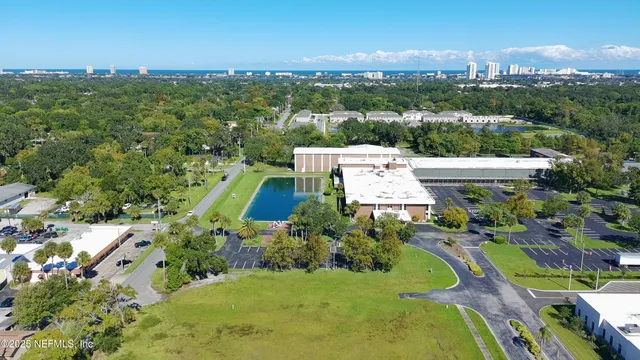 a view of a building with a yard