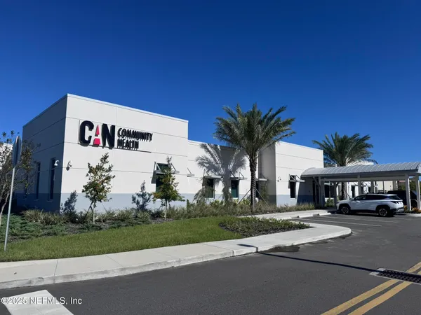 a view of a swimming pool and a yard