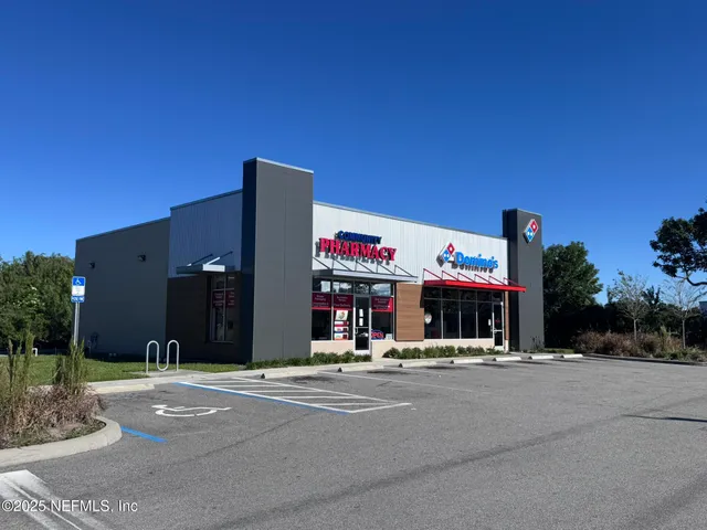 a view of a swimming pool with an outdoor space and seating area
