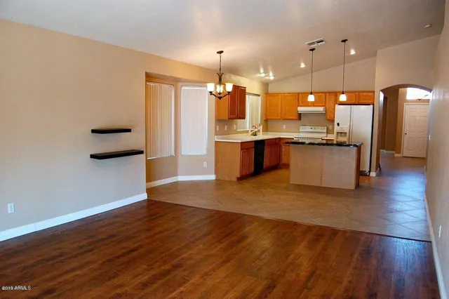 a bathroom with a double vanity sink a mirror and a bathtub