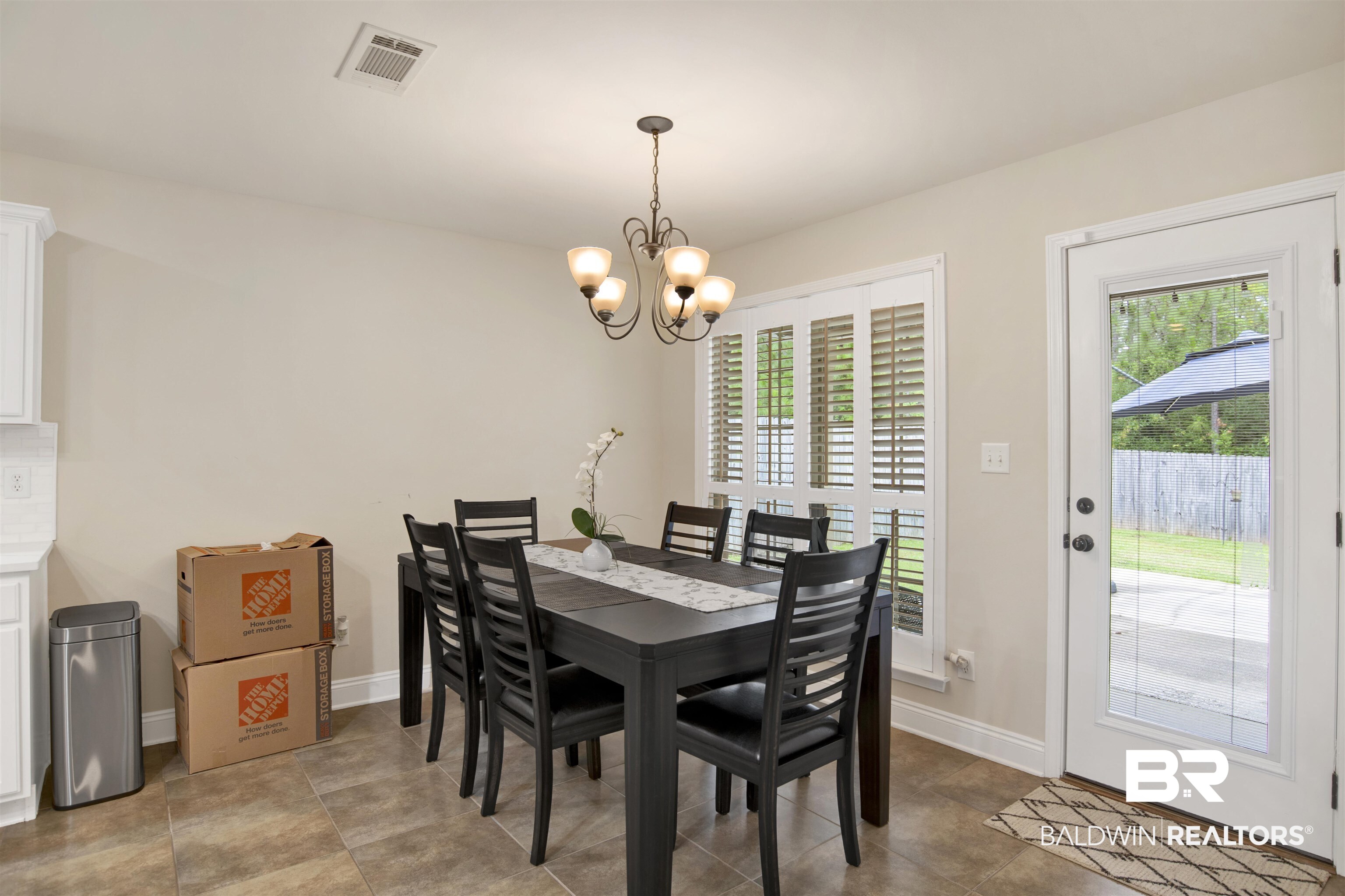 8542 Three Dean Way Mobile, AL 36695 - Photo 7 of 26 Dining area featuring a chandelier and baseboards