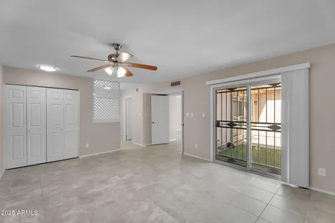 a view of an empty room with a window
