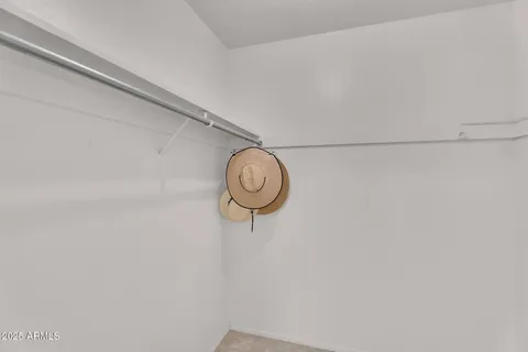 a view of a storage and utility room with racks on the wall
