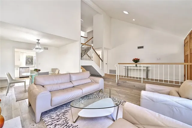 a living room with furniture and a table