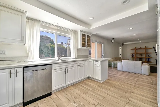 a large kitchen with a lot of counter space and a sink