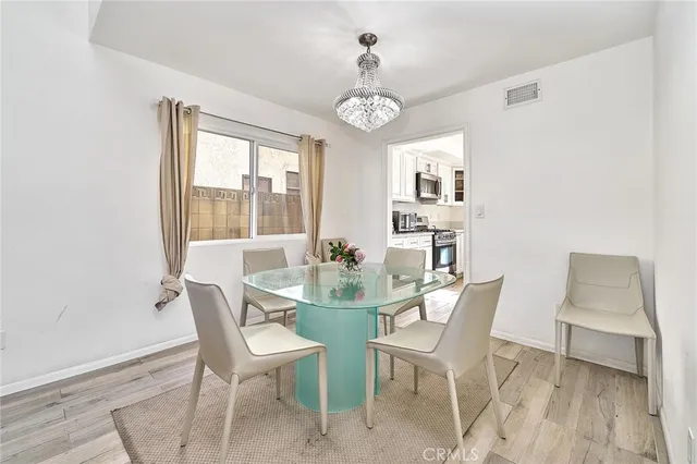 a view of a dining room with furniture and window