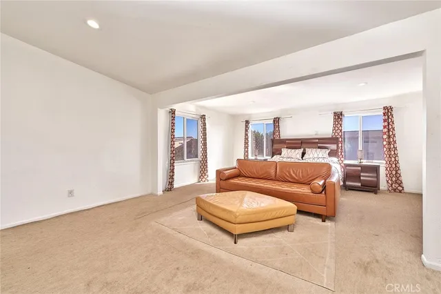 a spacious bathroom with a tub sink and mirror