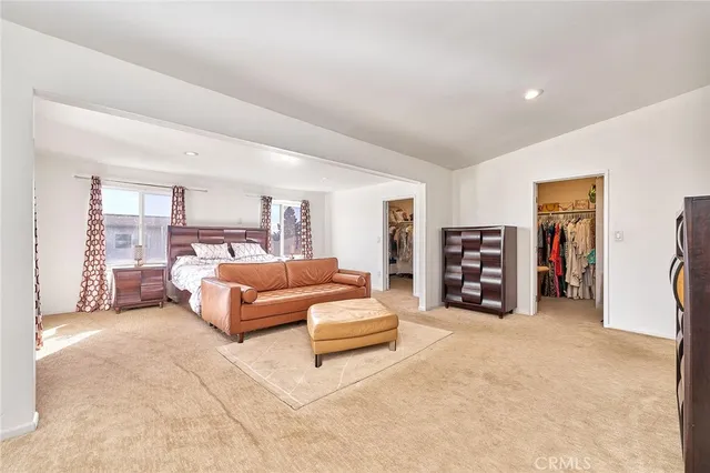 a spacious bathroom with a double vanity sink and a mirror