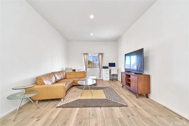 a view of a house with a patio and a yard