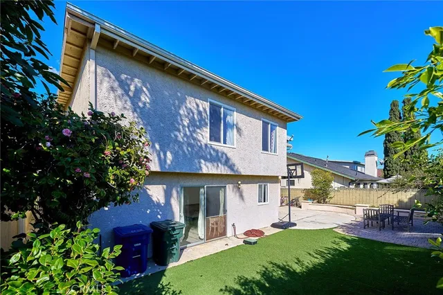 an aerial view of a house with yard
