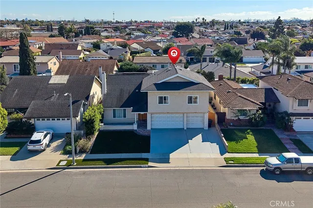 an aerial view of a house with a ocean view