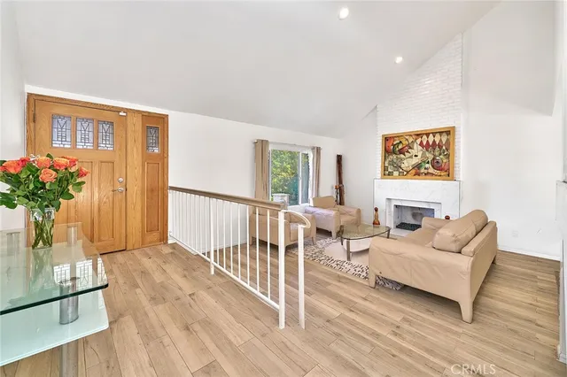 a living room with furniture and flowers