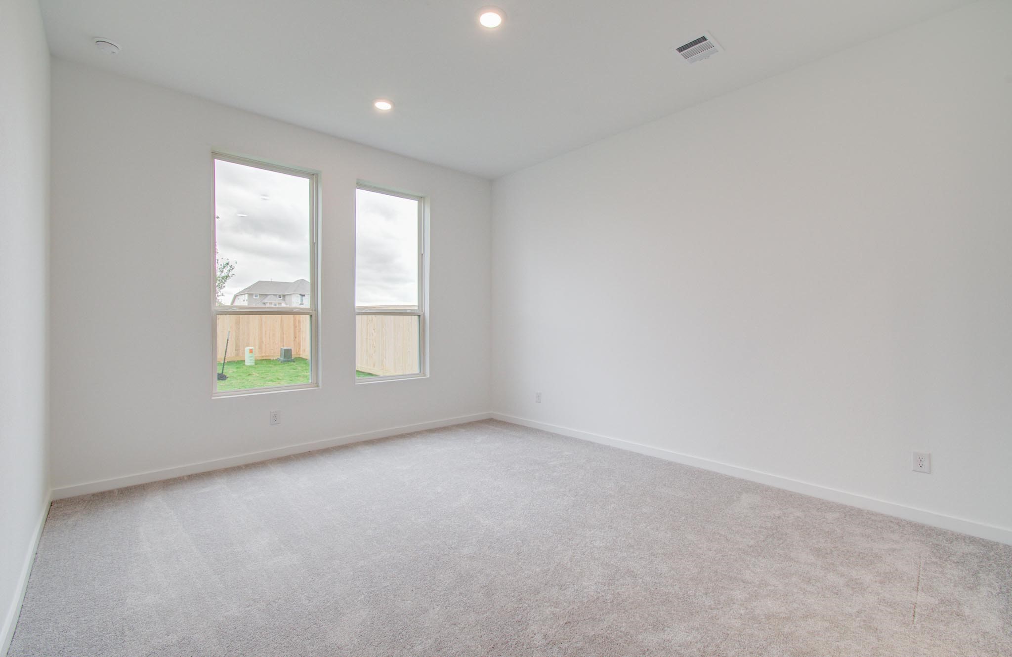 11122 Swamp Edge Lane Cypress, TX 77433 - Photo 20 of 43 an empty room with windows