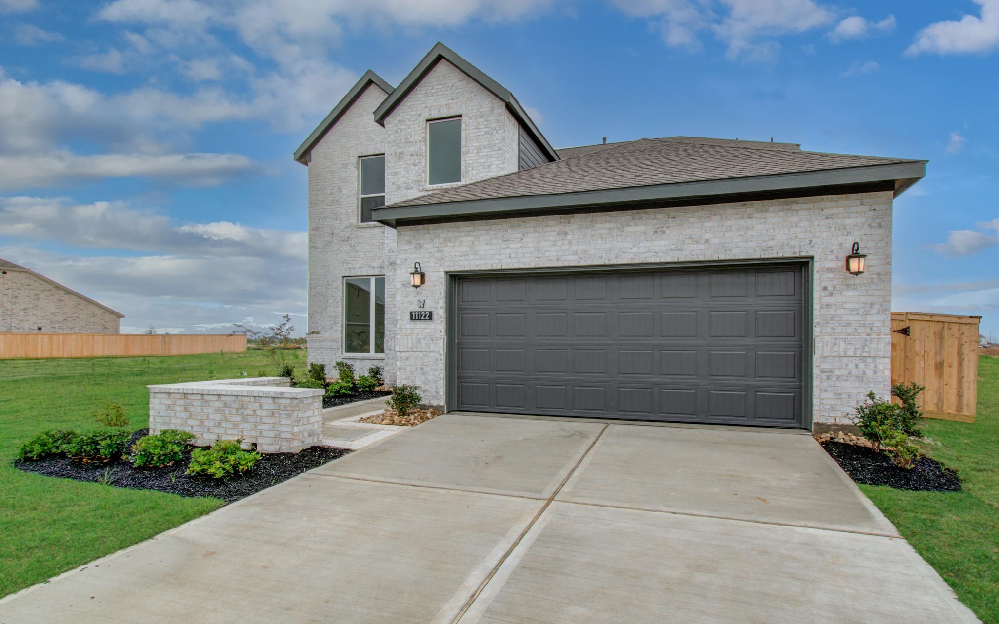 11122 Swamp Edge Lane Cypress, TX 77433 - Photo 2 of 43 a front view of a house with a yard and garage