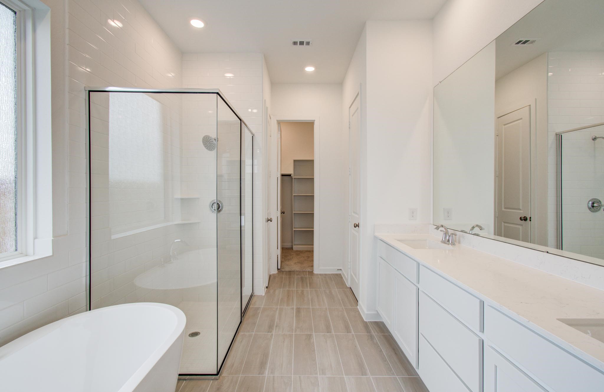 11122 Swamp Edge Lane Cypress, TX 77433 - Photo 22 of 43 a bathroom with a sink a toilet and shower