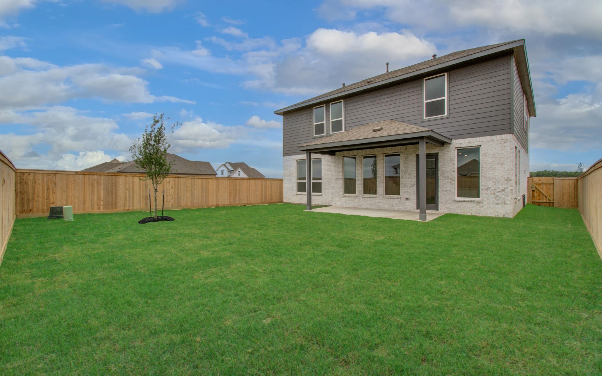 11122 Swamp Edge Lane Cypress, TX 77433 - Photo 42 of 43 a view of a house with a backyard