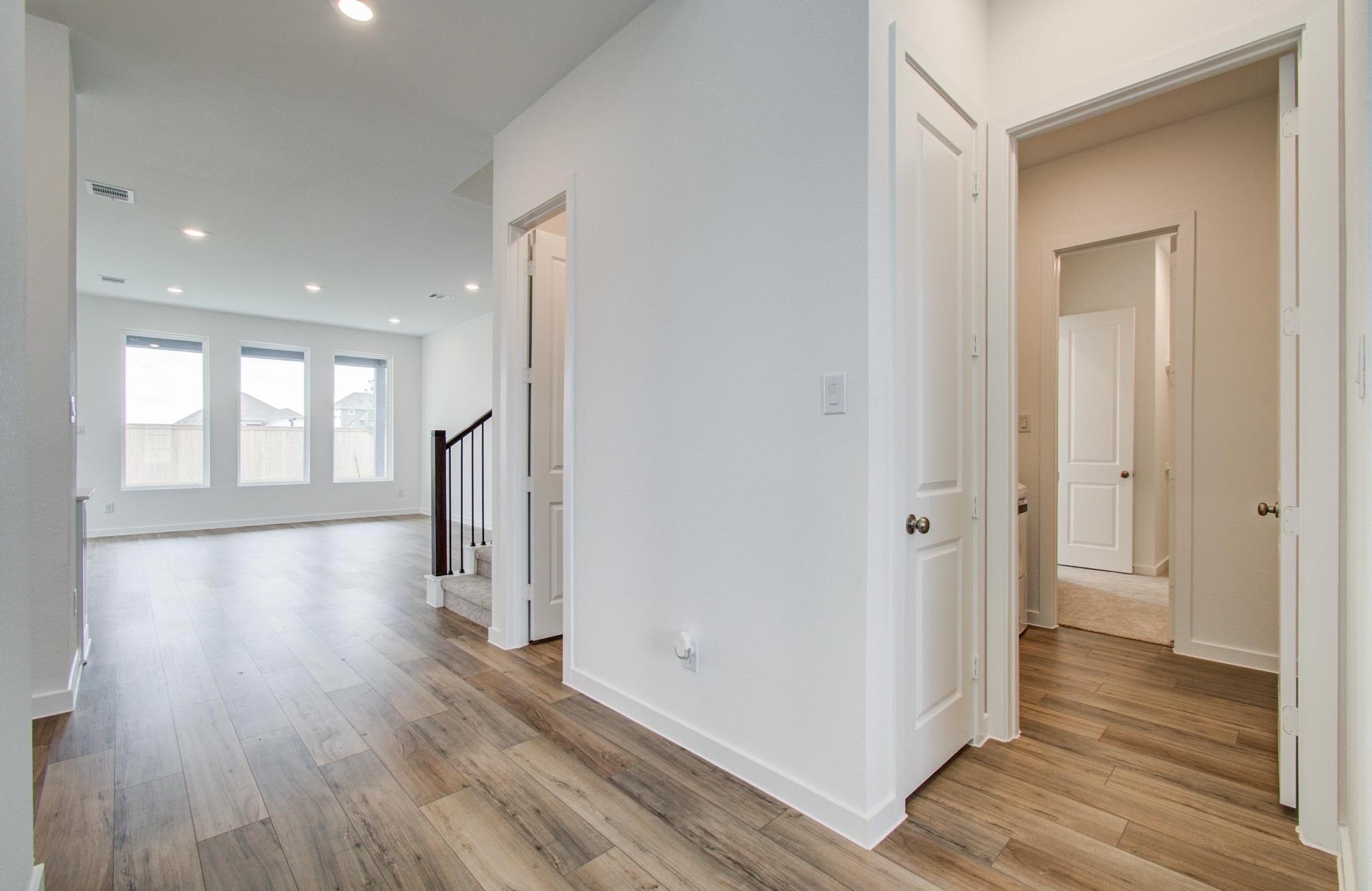 11122 Swamp Edge Lane Cypress, TX 77433 - Photo 7 of 43 a view of an empty room with wooden floor and a window
