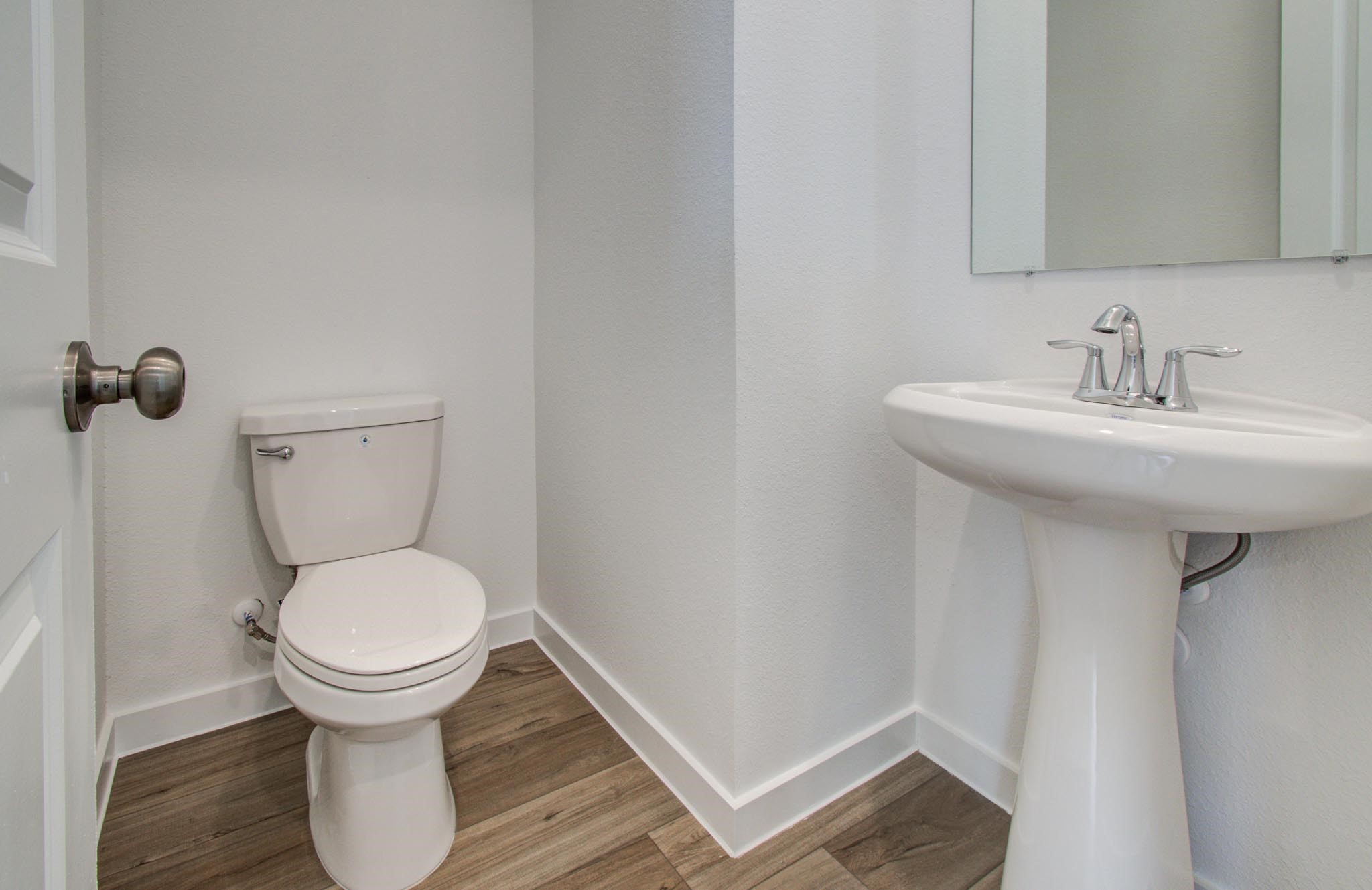 11122 Swamp Edge Lane Cypress, TX 77433 - Photo 9 of 43 a bathroom with a sink and a toilet