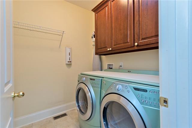 1993 Shell Road Hendersonville, TN 37075 - Photo 11 of 20 Laundry with tile flooring and built in cabinets