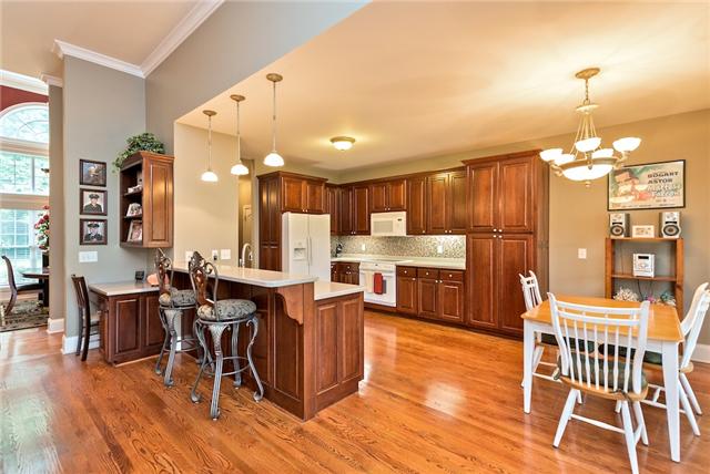 1993 Shell Road Hendersonville, TN 37075 - Photo 6 of 20 Kitchen area is huge with eat in area, bar, hardwoods, lots of cabinets and appliances remain!