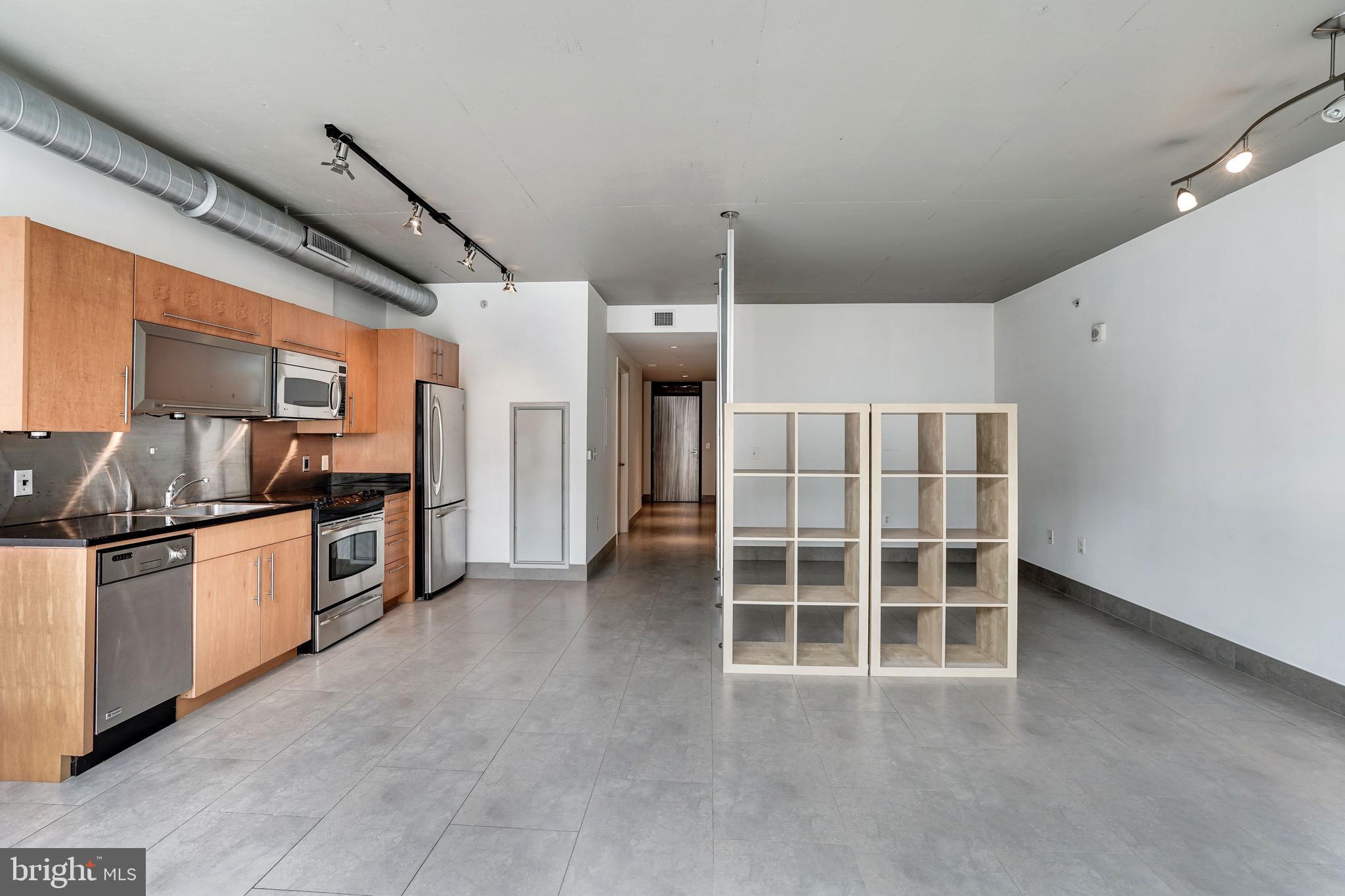 1133 14th Street Northwest, Unit 809 Washington, DC 20005 - Photo 11 of 27 a view of a kitchen with large windows