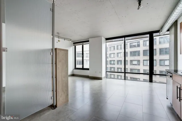 a view of an empty room with a window