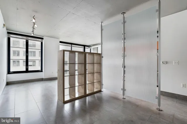 a view of an empty room with a window