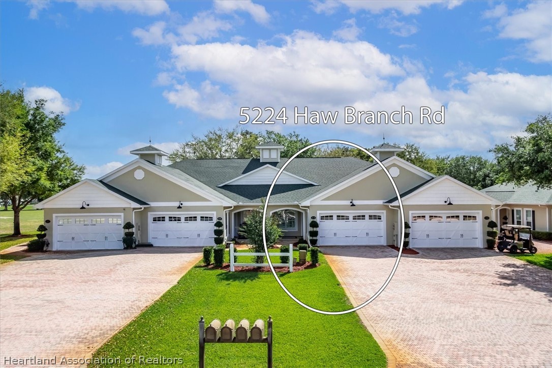 5224 Haw Branch Road Sebring, FL 33875 - Photo 30 of 40 a view of a house with swimming pool and a yard