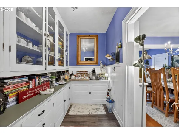 a kitchen filled with stainless steel appliances kitchen island granite countertop a refrigerator and cabinets