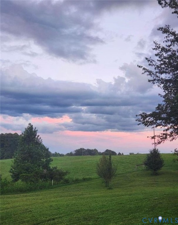 373 Chinquapin Road Prospect, VA 23960 - Photo 15 of 17 a view of a lake with sunset view