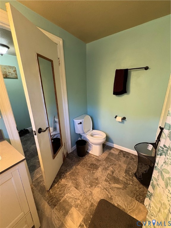 373 Chinquapin Road Prospect, VA 23960 - Photo 7 of 17 a bathroom with a toilet a sink and a mirror