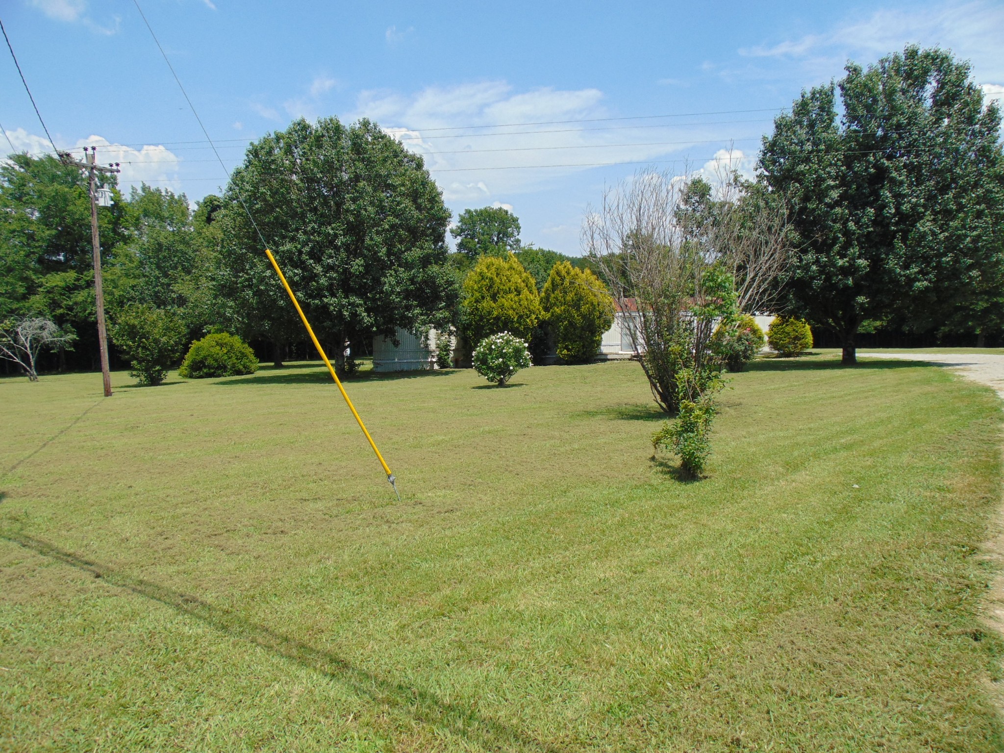 a view of an outdoor space and basketball court
