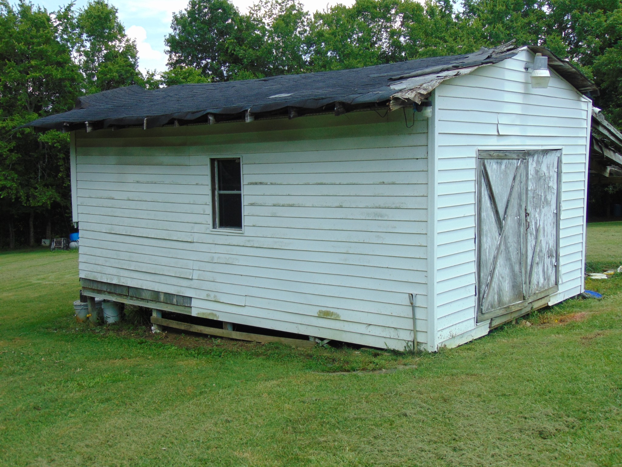1361 Yell Road Lewisburg, TN 37091 - Photo 15 of 24 a view of a backyard with plants and a barbeque