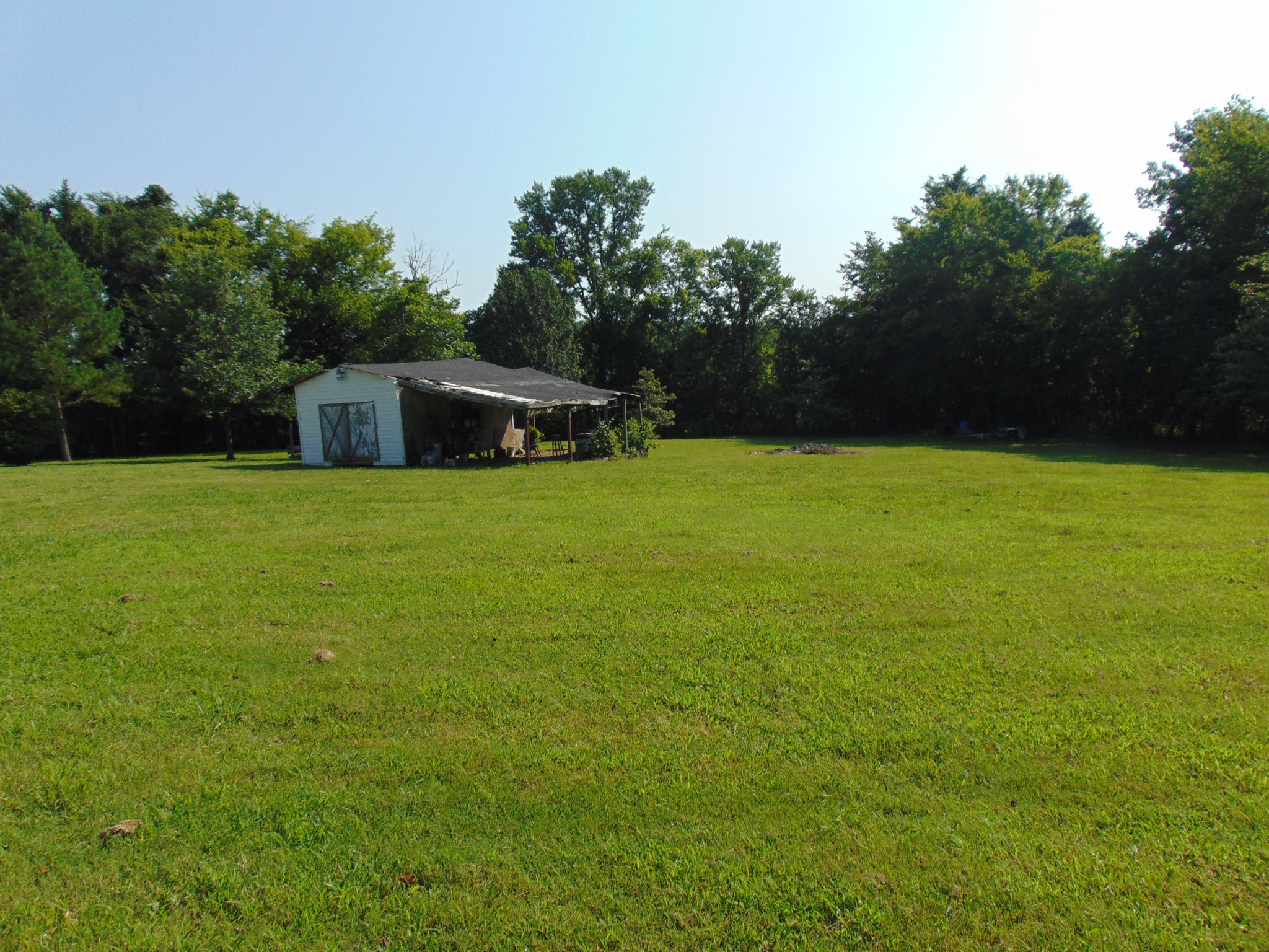 1361 Yell Road Lewisburg, TN 37091 - Photo 16 of 24 a backyard of a house with lots of green space