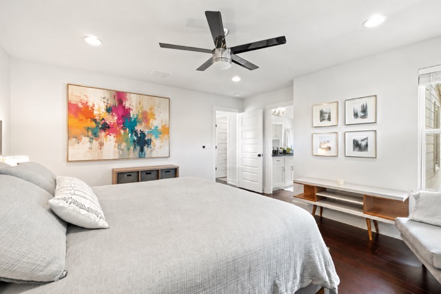 1182 Ridgeway Drive, Unit A Austin, TX 78702 - Photo 17 of 35 a bedroom with a bed and a painting on the wall