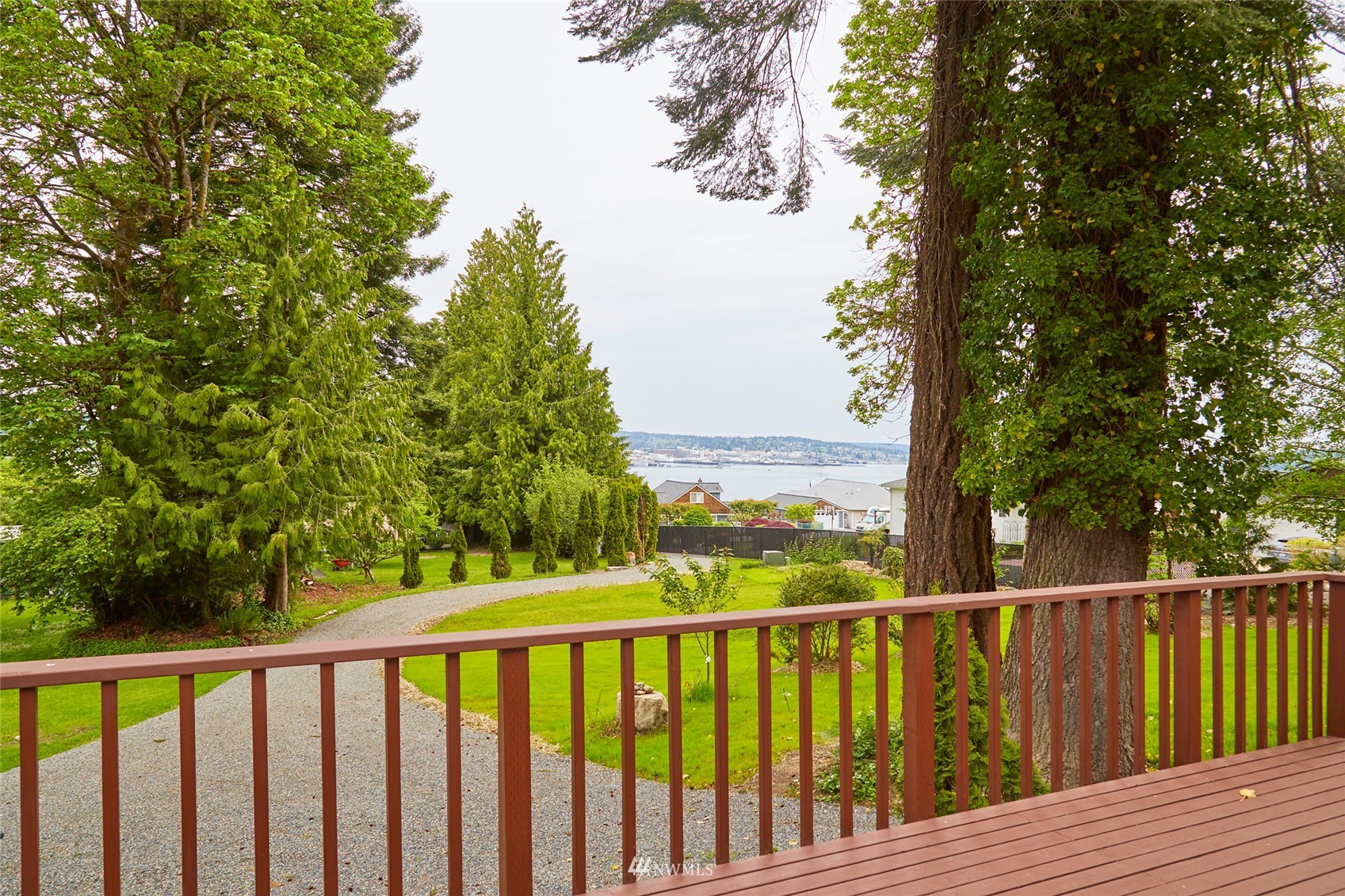 1446 Dogwood Hill Road Southwest Port Orchard, WA 98366 - Photo 12 of 31 a balcony with wooden floor and fence