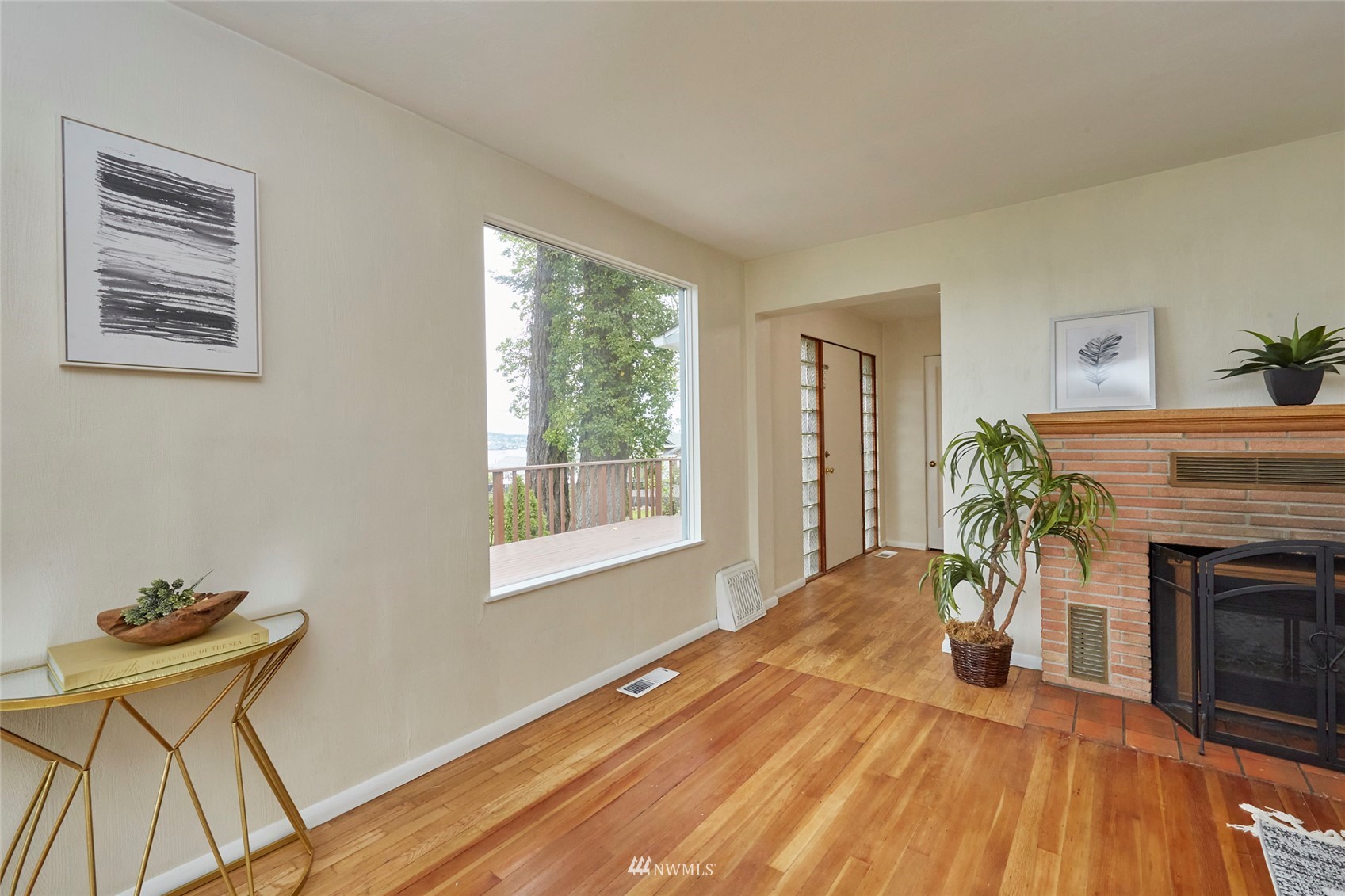 1446 Dogwood Hill Road Southwest Port Orchard, WA 98366 - Photo 18 of 31 a bedroom with a bed and a fireplace