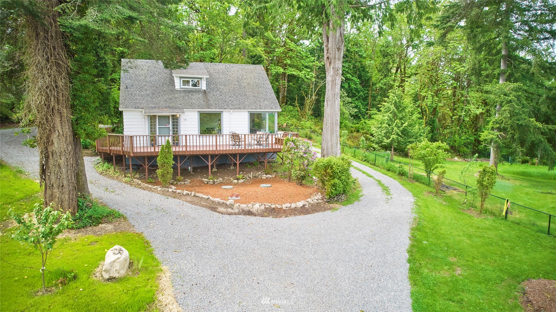 1446 Dogwood Hill Road Southwest Port Orchard, WA 98366 - Photo 2 of 31 an aerial view of a house with swimming pool and garden