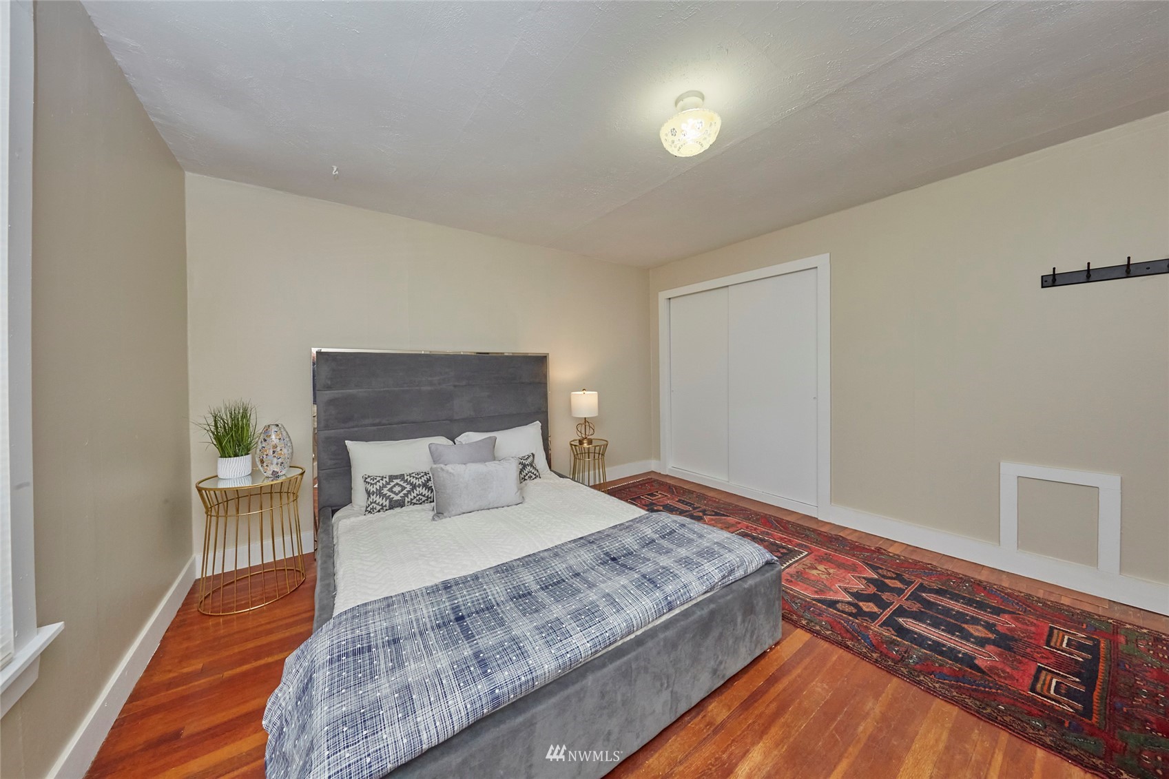 1446 Dogwood Hill Road Southwest Port Orchard, WA 98366 - Photo 24 of 31 a bedroom with a bed and a night stand