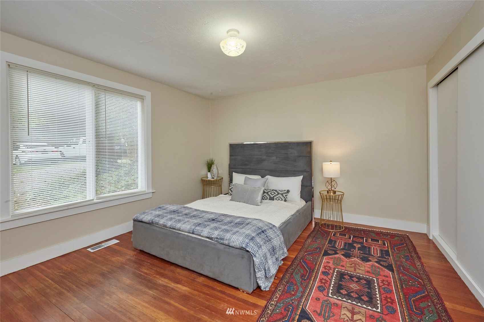 1446 Dogwood Hill Road Southwest Port Orchard, WA 98366 - Photo 25 of 31 a bedroom with a bed and wooden floor