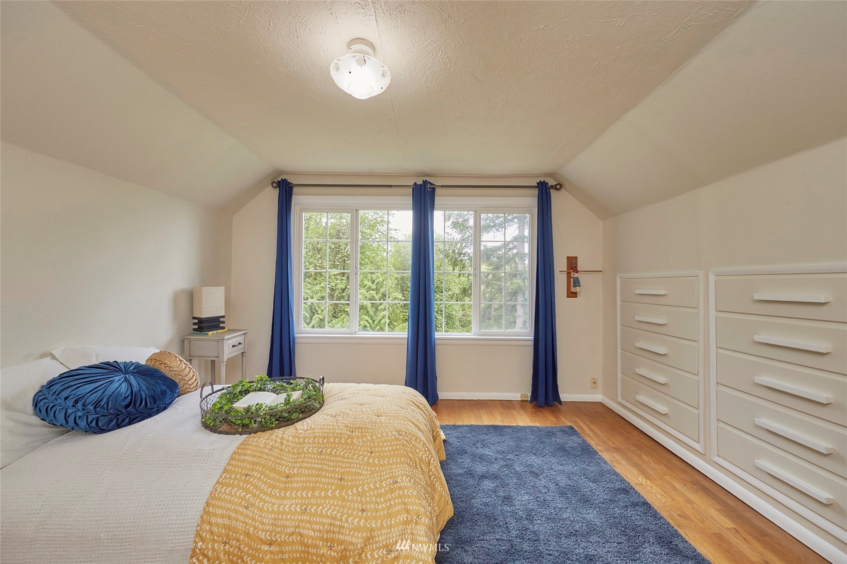 1446 Dogwood Hill Road Southwest Port Orchard, WA 98366 - Photo 27 of 31 a bedroom with a bed and a large window