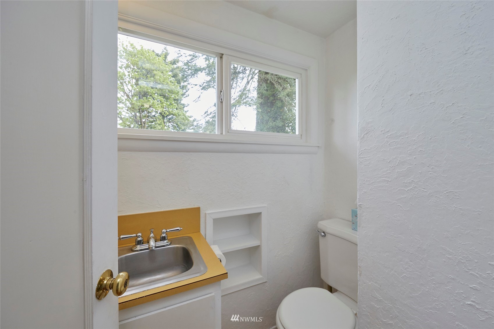 1446 Dogwood Hill Road Southwest Port Orchard, WA 98366 - Photo 29 of 31 a bathroom with a toilet sink and window