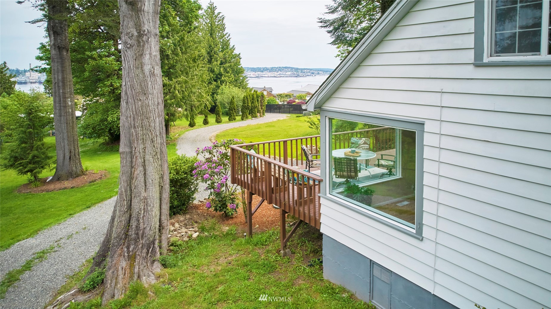 1446 Dogwood Hill Road Southwest Port Orchard, WA 98366 - Photo 3 of 31 a view of a balcony with floor to ceiling windows with wooden fence