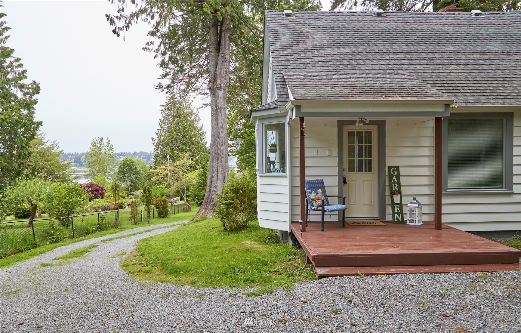 1446 Dogwood Hill Road Southwest Port Orchard, WA 98366 - Photo 4 of 31 a front view of a house with a yard